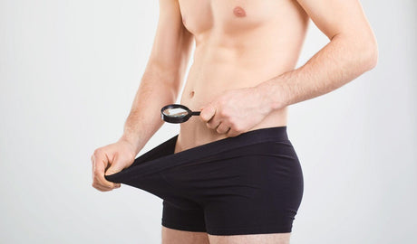 Look at penis with magnifying glass.